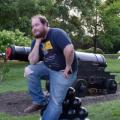 ethan next to a cannon