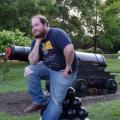 ethan next to a cannon