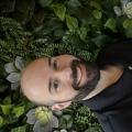 chris wells - a bald man with a beard