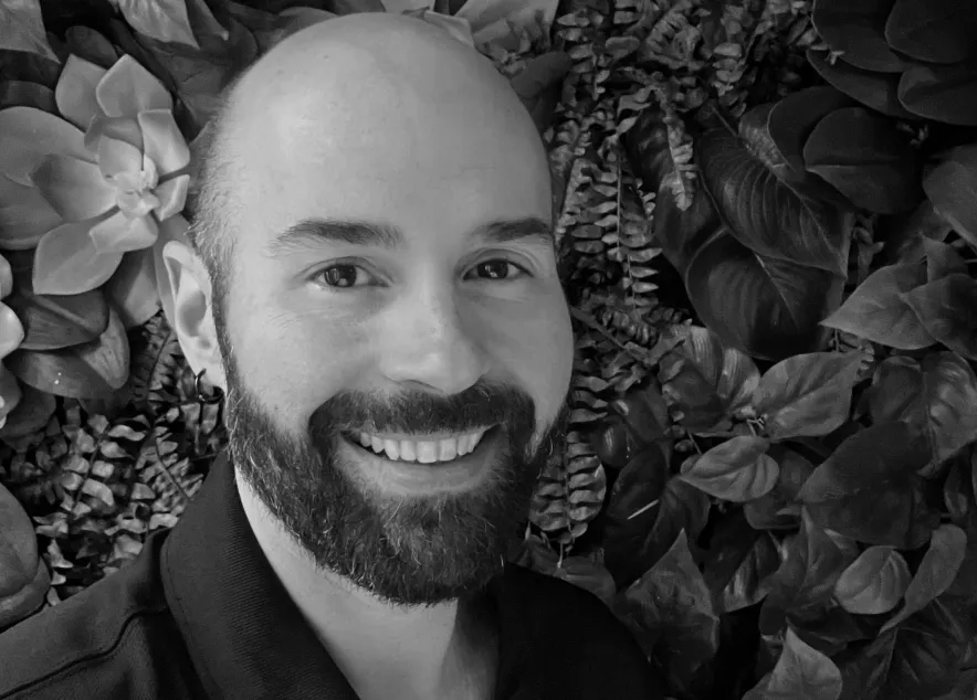 chris wells - a bald man with a beard