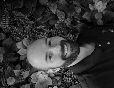 chris wells - a bald man with a beard