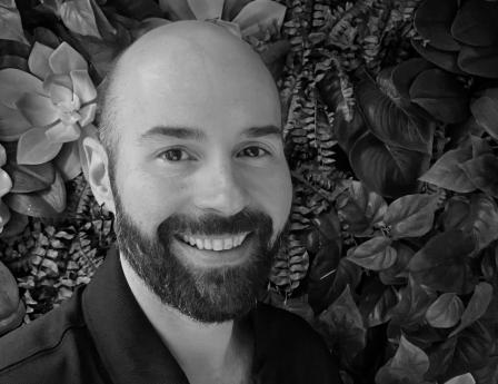 chris wells - a bald man with a beard